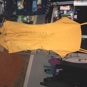 Yellow romper tie in back.